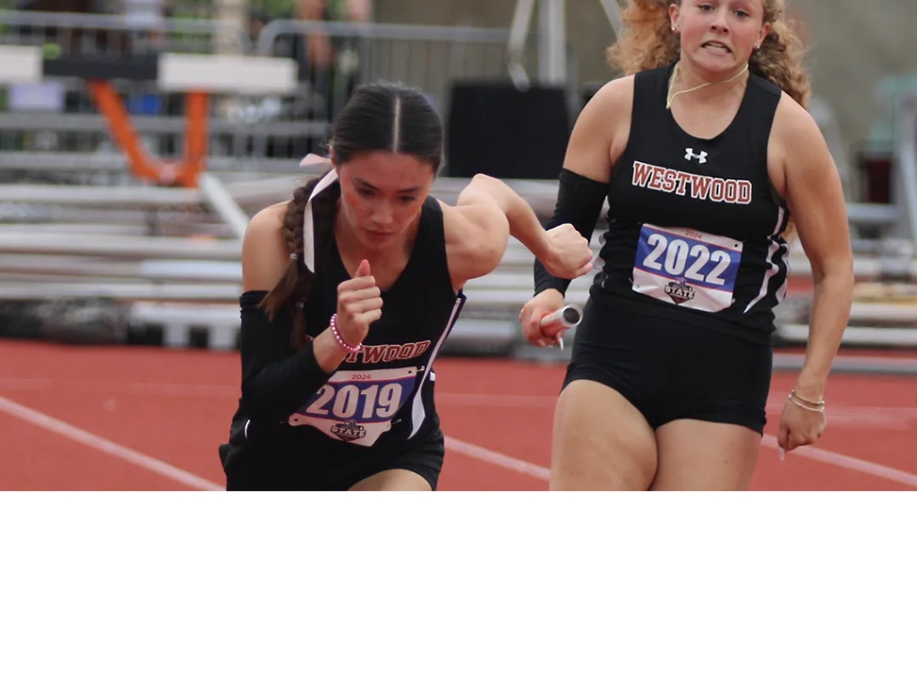Westwood&rsquo;s Violet Hewett takes the baton from Addy Sanderville in the first exchange of the Class 6A girls 4&times;100 meter relay at the UIL state track and field meet on Saturday, May 4, 2024 at Mike A. Myers Stadium in Austin, Texas. (Michael Adams/Austin Sports Journal)